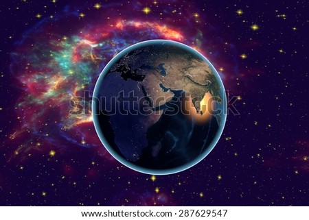 Planet Earth on the background with stars and galaxies; the Earth from space showing /arabian peninsula, Africa, India on globe in the night time; elements of this image furnished by NASA