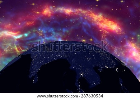 Planet Earth on the background with stars and galaxies; the Earth from space showing India and Malaysia on globe in the night time; elements of this image furnished by NASA