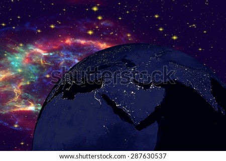 Planet Earth on the background with stars and galaxies; the Earth from space showing Arabian peninsula and Africa on globe in the night time; elements of this image furnished by NASA