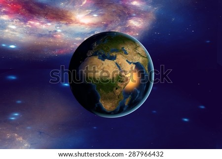 The Earth from space on the background with stars and galaxies showing Africa on globe in the day time; elements of this image furnished by NASA