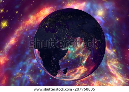 Planet Earth on the background with stars and galaxies; the Earth from space showing Arabian peninsula, India and Africa on globe in the night time; elements of this image furnished by NASA
