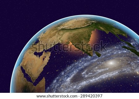 Planet Earth on the background with stars and galaxies; the Earth from space showing India and Arabian peninsula on globe in the day time; elements of this image furnished by NASA