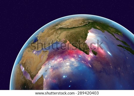 Planet Earth on the background with stars and galaxies; the Earth from space showing India and Arabian peninsula on globe in the day time; elements of this image furnished by NASA
