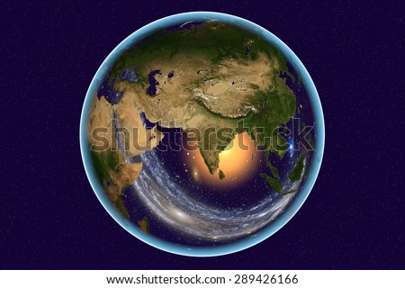 Planet Earth on background with stars; the Earth from space showing India, Arabian peninsula, Russia on globe in the day time; galaxies are reflected in water; elements of this image furnished by NASA