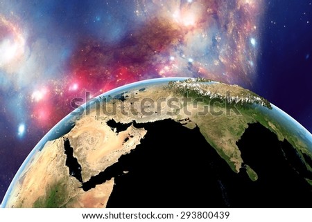 Planet Earth on background with stars and galaxies; the Earth from space showing India, Himalayas, Arabian peninsula on globe in day; with enhanced bump; elements of this image furnished by NASA
