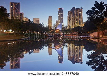 Kuala Lumpur, Malaysia January 25 2015: Some newly developed buildings get reflected at still pool outside of Kuala Lumpur City Center (KLCC).