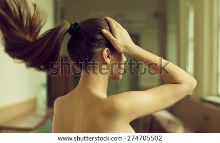 Woman with long silky black hair nude
