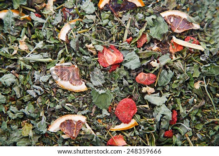 Texture of dry herbal tea with mint, strawberry and slices of lemon