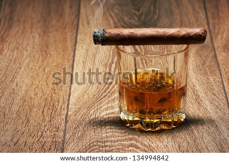 Whiskey and Cigar on black background