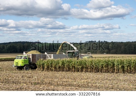 DRESDEN, GERMANY - September 15 2015: corn harvester in the Corn crop