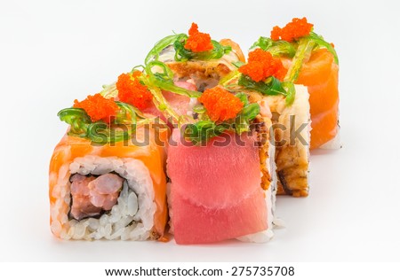 Japanese Cuisine - Sushi and Rolls with Tuna, Salmon, Flying Fish Roe, Seafood, Vegetables, Cream Cheese, isolated on a white background