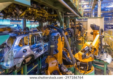 TOGLIATTI, RUSSIA - JANUARY 24: Robots welding in a car factory. Welding car body of LADA Cars in Automobile Factory AVTOVAZ on January 24, 2014 in Togliatti
