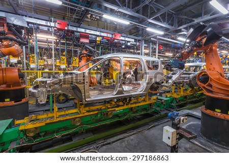 TOGLIATTI, RUSSIA - NOVEMBER 13: Robots welding in a car factory. Welding car body of LADA Cars in Automobile Factory AVTOVAZ on November 13, 2013 in Togliatti