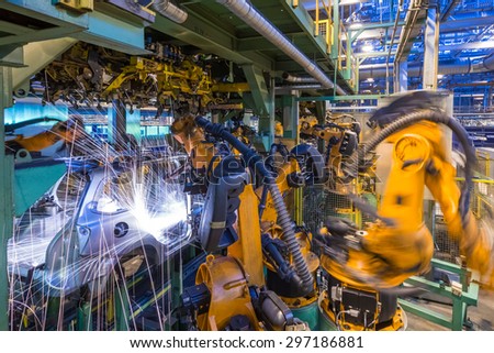 TOGLIATTI, RUSSIA - JANUARY 24: Robots welding in a car factory. Welding car body of LADA Cars in Automobile Factory AVTOVAZ on January 24, 2014 in Togliatti