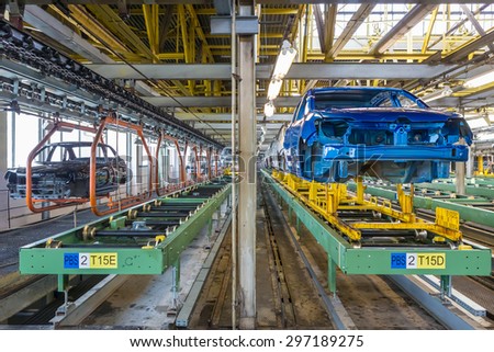 TOGLIATTI, RUSSIA - JUNE 26: Paint Shop Line B0. Robots painting car body of LADA Cars in Automobile Factory AVTOVAZ on June 26, 2015 in Togliatti