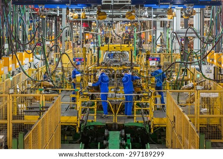 TOGLIATTI, RUSSIA - NOVEMBER 12: Body Shop B0 Line. Robots welding in a car factory. Welding car body of LADA Cars in Automobile Factory AVTOVAZ on November 12, 2013 in Togliatti