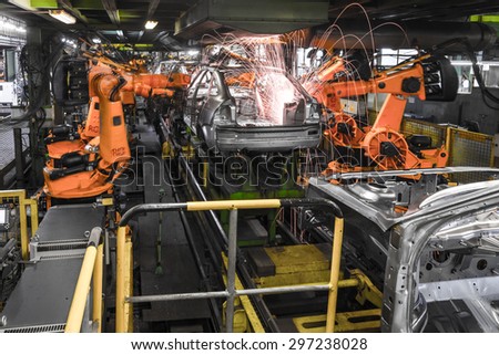 TOGLIATTI, RUSSIA - DECEMBER 06: Robots welding in a car factory. Welding car body of LADA Cars in Automobile Factory AVTOVAZ on December 06, 2013 in Togliatti