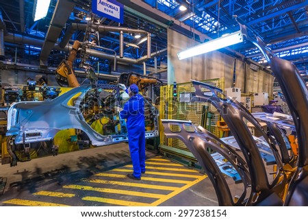 TOGLIATTI, RUSSIA - JANUARY 26: Robots welding in a car factory. Welding car body of LADA Cars in Automobile Factory AVTOVAZ on January 26, 2014 in Togliatti
