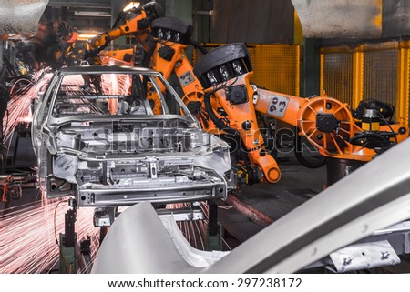 TOGLIATTI, RUSSIA - DECEMBER 06: Robots welding in a car factory. Welding car body of LADA Cars in Automobile Factory AVTOVAZ on December 06, 2013 in Togliatti