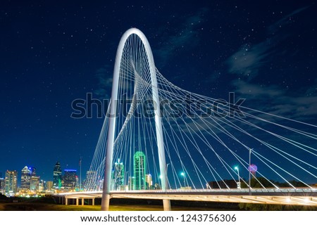 Margaret Hunt Hill Bridge at night  in Dallas, Texas,Margaret Hunt Hill Bridge and Dallas downtown skyline.
