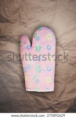Kitchen glove   vintage  on a  paper background