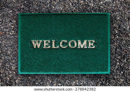 welcome mat on the floor background