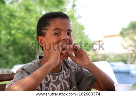 Little boy eating cake