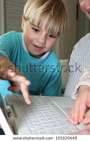 Boy learning computer skills