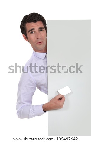 Man with business card and advertising panel