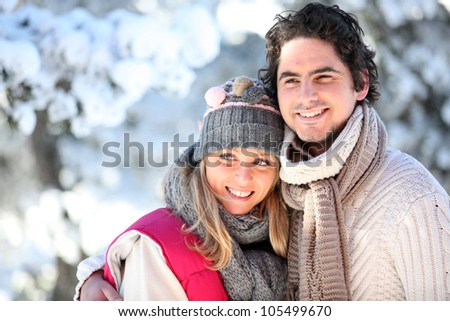 portrait of happy couple at winter resort