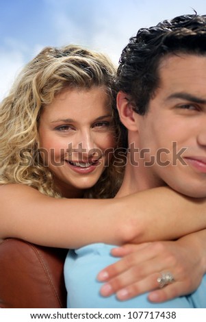 Couple hugging on a sunny day