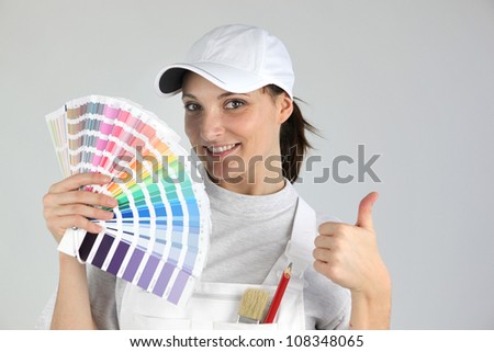 Decorator holding paint swatch