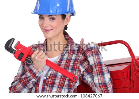 Female plumber ready for her next job
