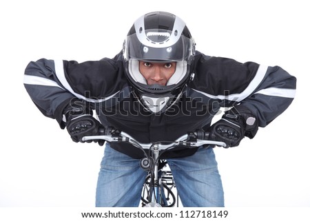 Motorcyclist on a push bike