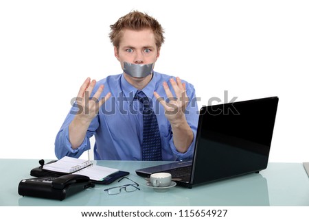 Office worker with his mouth taped shut