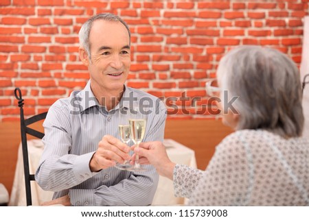 Elderly couple celebrating anniversary
