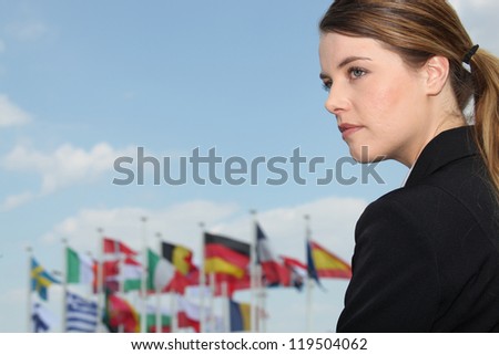 Woman with flags in the background