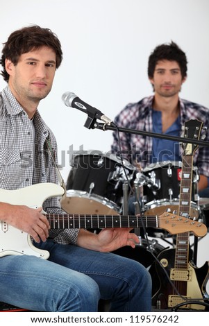 Youth with guitar and drums
