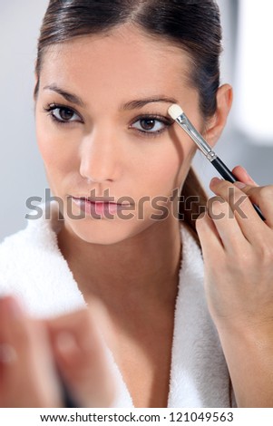 Woman applying eye make-up