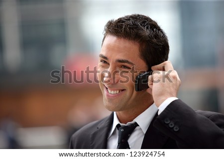 handsome businessman having phone call