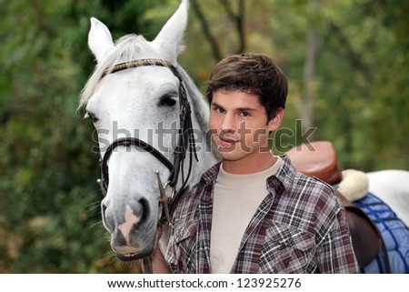 man strolling with horse