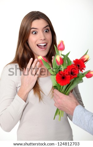 Woman receiving bouquet of flowers