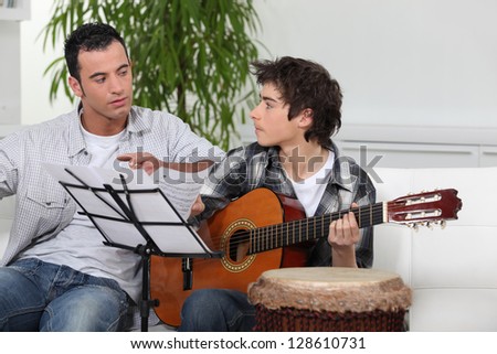 Father and son with guitar
