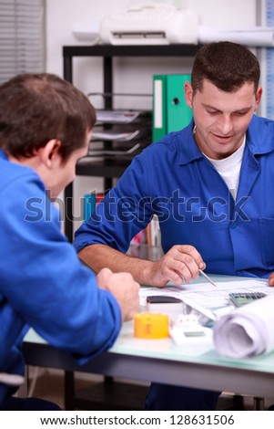 Two warehouse managers checking stock
