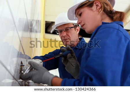 Electrician and his apprentice Electrician and his apprentice
