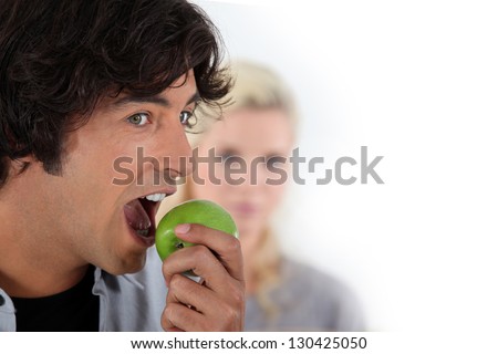Man eating apple