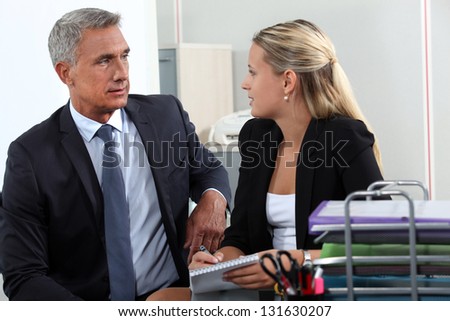 Man and woman flirting in office