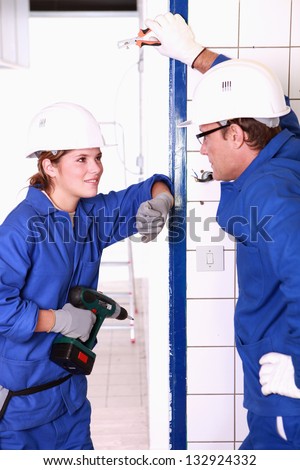 Electricians chatting on the job