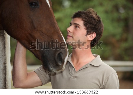 Man stood with horse