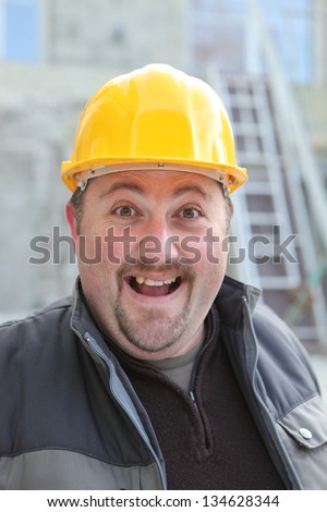 Excited chubby manual worker